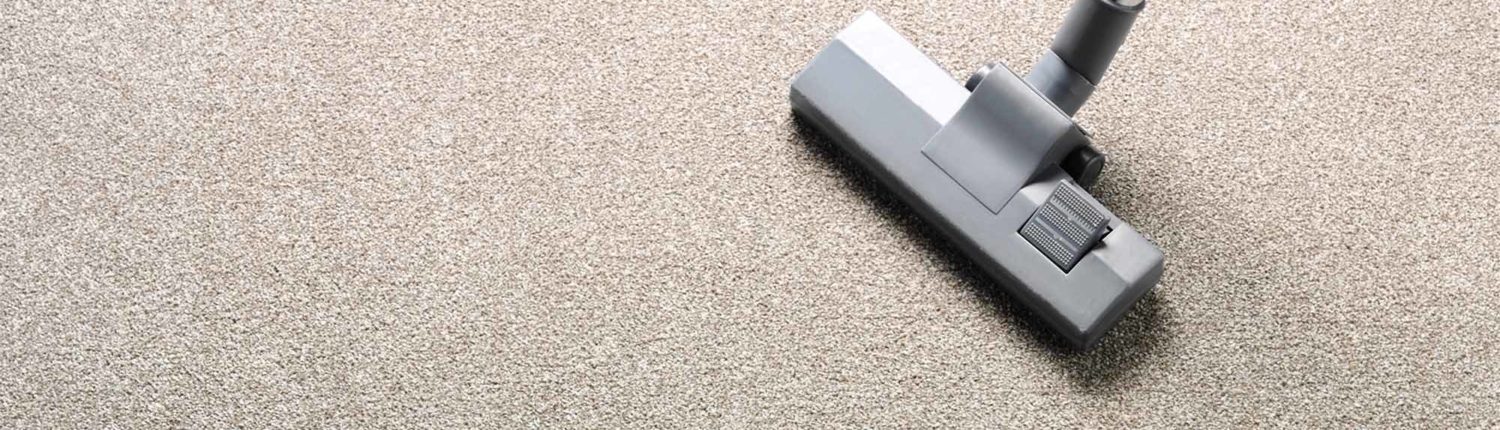 a vacuum cleaner on carpet