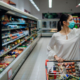 Female customer shopping in clean supermarket