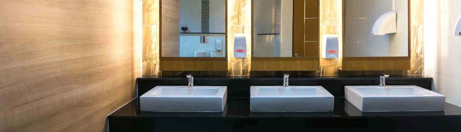 Commercial bathroom with three sinks