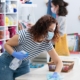 Retail workers cleaning shop