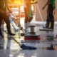 Workers cleaning commercial floor