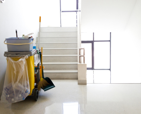 Back view of janitor cart in hallway