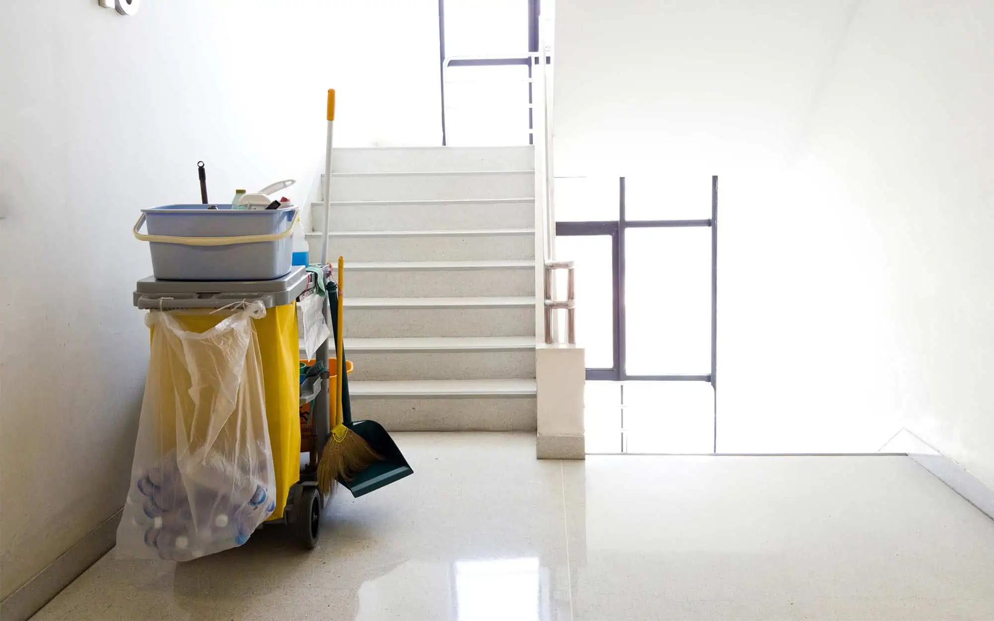 Back view of janitor cart in hallway