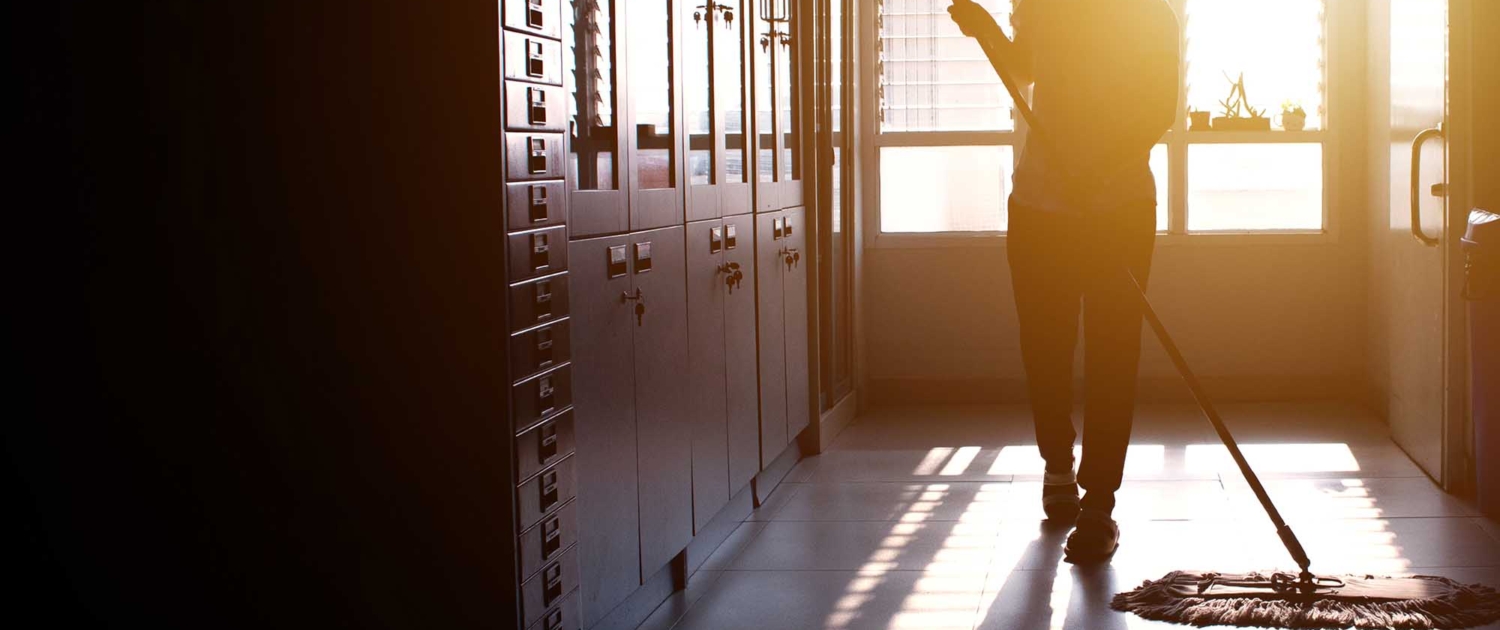 Importance-of-school-clenaing-now-Blog_november2 school hallway being cleaned by a worker