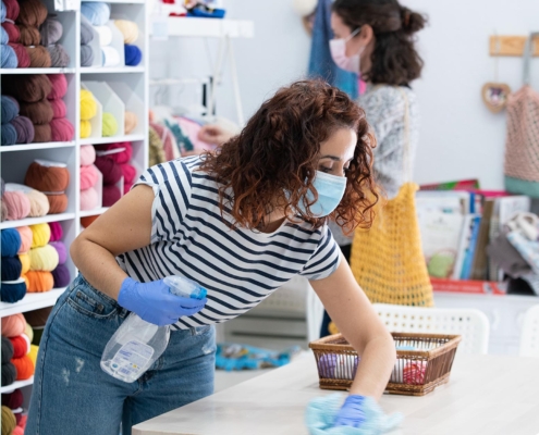 Workers cleaning retail counter