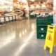Wet Floor Sign in Front of Crates in Grocery Store