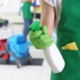 Janitor Spraying Down Surface To Clean
