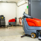 Industrial Cleaning Equipment In A Storage Area With Multiple Machines